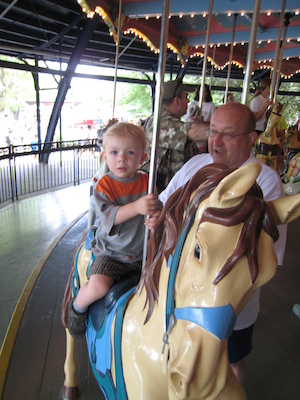 Cole and Poppy on the merry go round (06-14-2007 14:30)