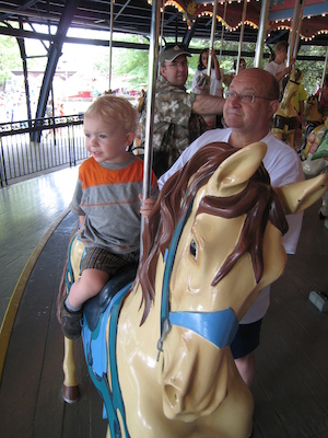 Cole and Poppy on the merry go round (06-14-2007 14:30)