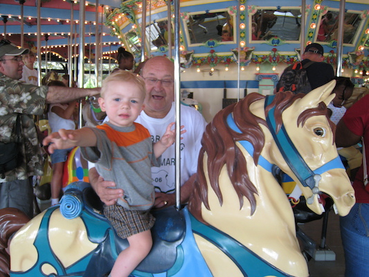 Cole and Poppy on the merry go round (06-14-2007 14:30)