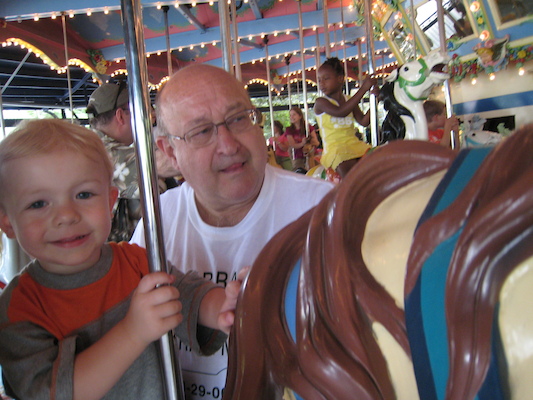Cole and Poppy on the merry go round (06-14-2007 14:31)
