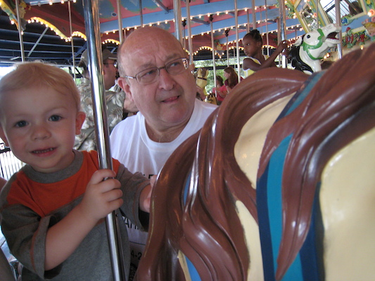 Cole and Poppy on the merry go round (06-14-2007 14:31)