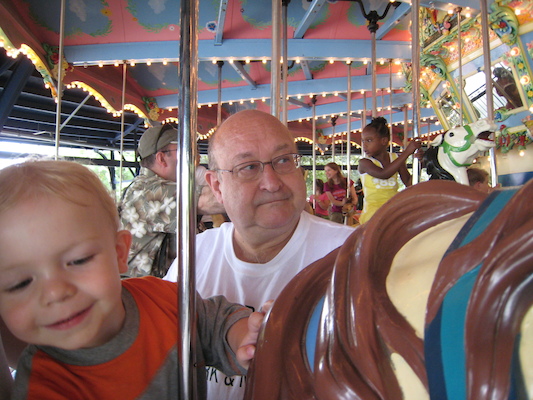 Cole and Poppy on the merry go round (06-14-2007 14:31)