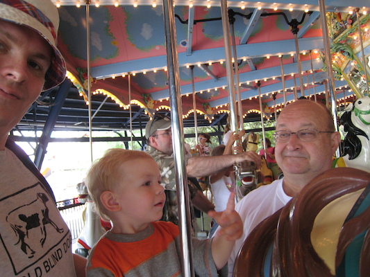 Ben, Cole and Poppy on the merry go round (06-14-2007 14:31)