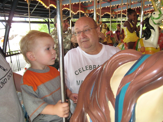 Cole and Poppy on the merry go round (06-14-2007 14:31)