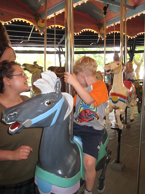Xine and Tim on the merry go round (06-14-2007 14:45)