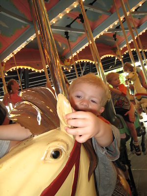 Cole and Tim on the merry go round (06-14-2007 14:50)