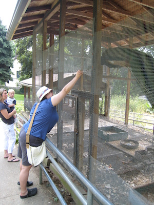 Christine feeding the peacock (06-16-2007 11:18)