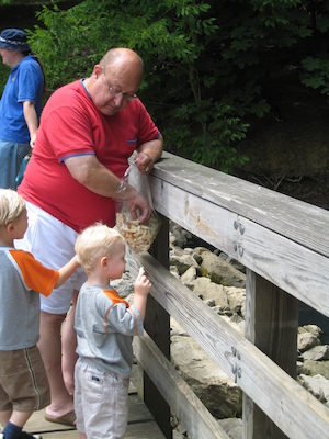 Poppy, Tim and Cole feeding the ducks (06-16-2007 12:10)