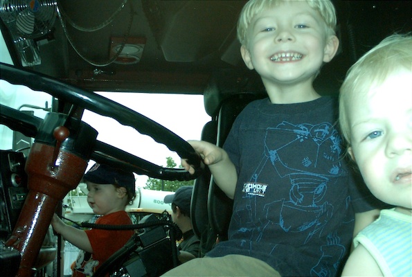 Tim and Cole driving a firetruck