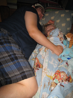 Mommy and Tim cuddling in bed (09-24-2007 20:34)