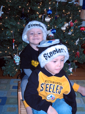 Tim and Cole in front of the tree (12-02-2007 08:33)