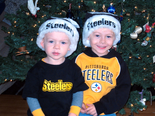 Tim and Cole in front of the tree (12-02-2007 08:43)