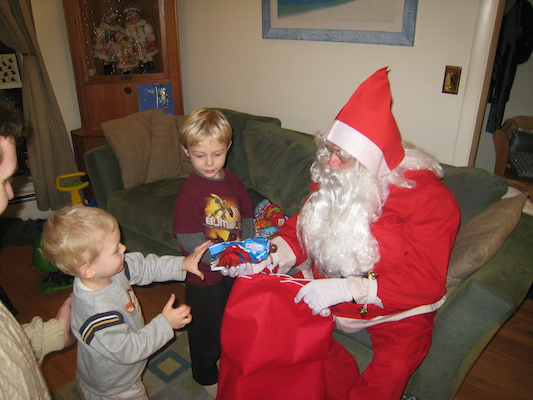 Cole getting his present from Santa (12-24-2007 19:11)