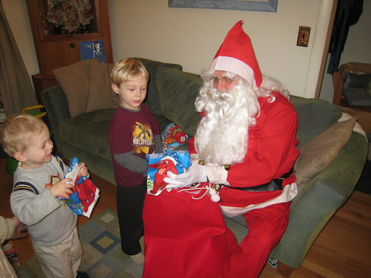 Tim getting his present from santa (12-24-2007 19:11)