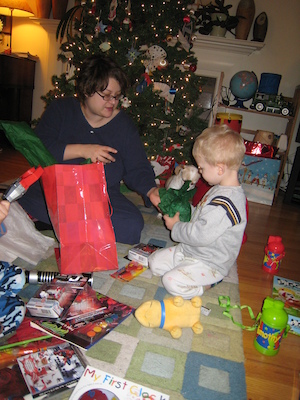 Mommy helps Cole open a present (12-25-2007 06:58)