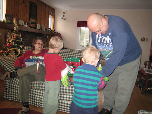 Mommy, Tim, Cole and Poppy open presents (12-25-2007 10:25)