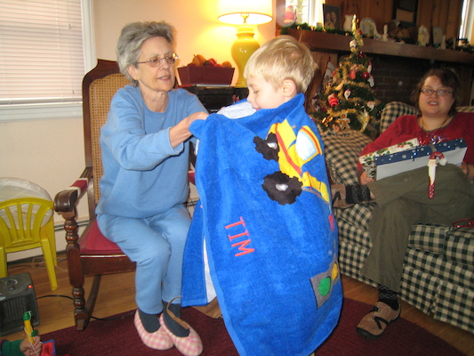 Nea enrobing Tim in his truck towel (12-25-2007 10:28)