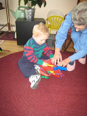 Cole and Nea packing up the fishing rod (12-25-2007 10:30)