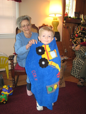 Nea enrobing Cole in his truck towel (12-25-2007 10:34)