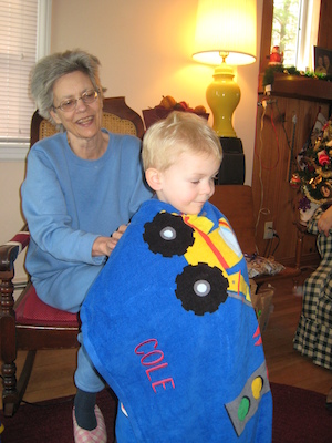 Nea enrobing Cole in his truck towel (12-25-2007 10:34)