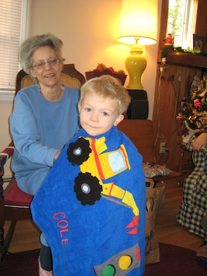 Nea enrobing Cole in his truck towel (12-25-2007 10:34)