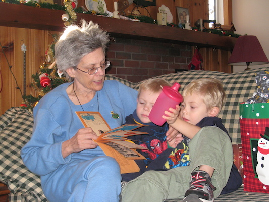 Nea reading to Cole and Tim (12-25-2007 12:38)