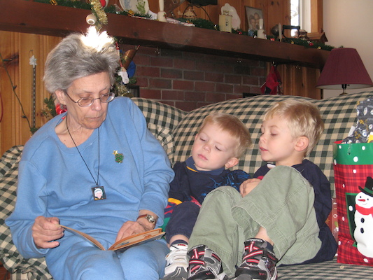 Nea reading to Cole and Tim (12-25-2007 12:38)