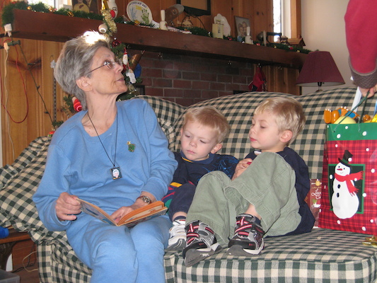 Nea reading to Cole and Tim (12-25-2007 12:38)