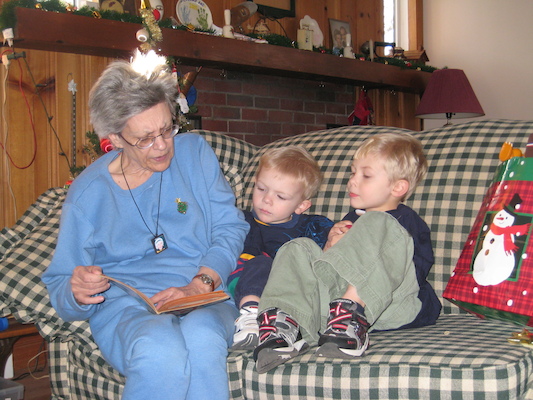 Nea reading to Cole and Tim (12-25-2007 12:38)
