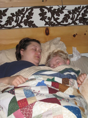 Xine and Tim cuddling in bed (04-25-2008 06:49)