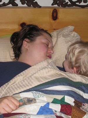 Xine and Tim cuddling in bed (04-25-2008 06:50)