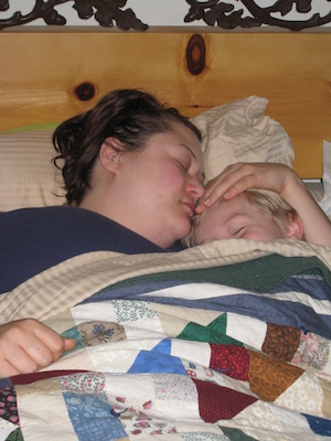 Xine and Tim cuddling in bed (04-25-2008 06:50)