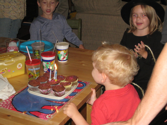 Cole blowing out candles with Tim and Emma (06-15-2008 17:43)