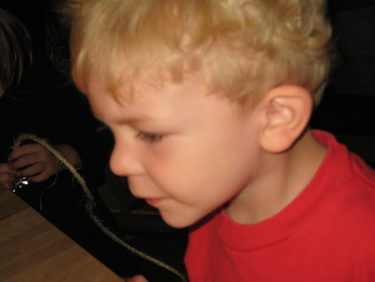 Cole pondeing his candles (06-15-2008 17:43)