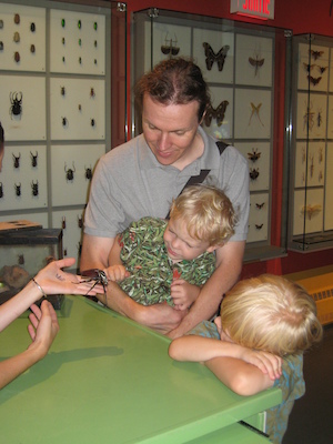 Ben, Cole and Tim looking at a beatle at the Insectarium (07-25-2008 09:09)