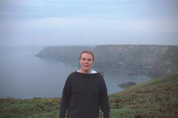 Ben in front of the coastline