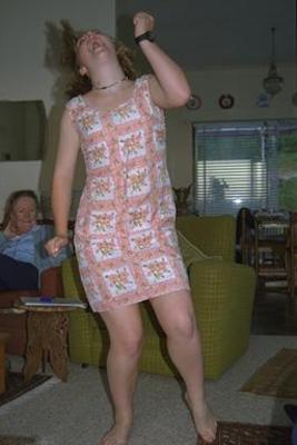 Beth dancing in a gross dress