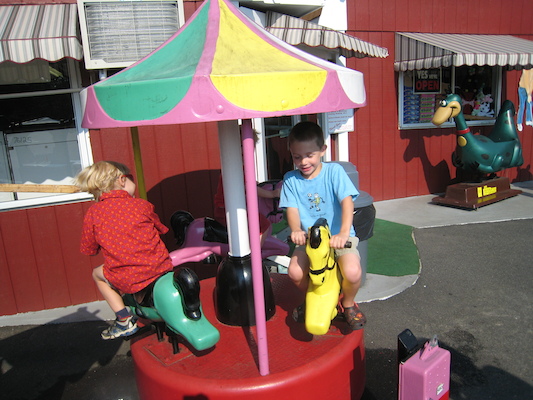 Tal, Tim and Cole on the merry-go-round (08-16-2008 15:15)
