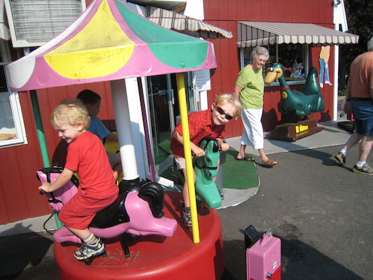 Tal, Tim and Cole on the merry-go-round (08-16-2008 15:15)