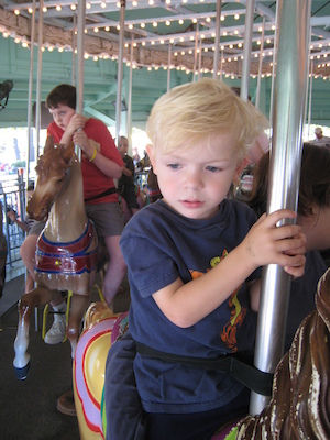 Cole and Xine on the merry-go-round (08-27-2008 11:47)