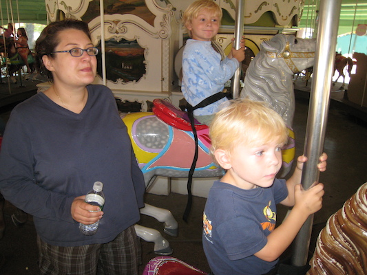 Cole, Xine and Tim on the merry-go-round (08-27-2008 11:53)