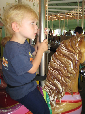 Cole on the merry-go-round (08-27-2008 11:53)
