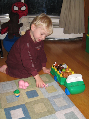 Cole playing with his animals (11-30-2008 18:39)