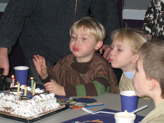 Tim & Cole blowing out candles (02-28-2009 13:41)