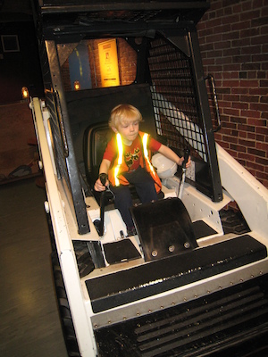 Cole driving a truck at the Children's Museum (04-10-2009 14:33)