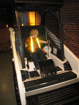Cole driving a truck at the Children's Museum (04-10-2009 14:33)