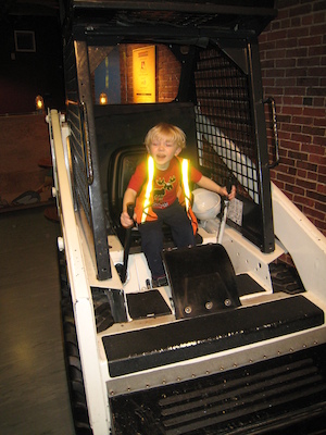 Cole driving a truck at the Children's Museum (04-10-2009 14:33)