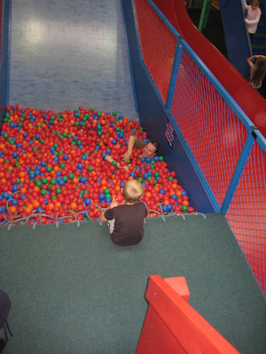 Ben in the ball pit, Tim watching (07-11-2009 11:08)