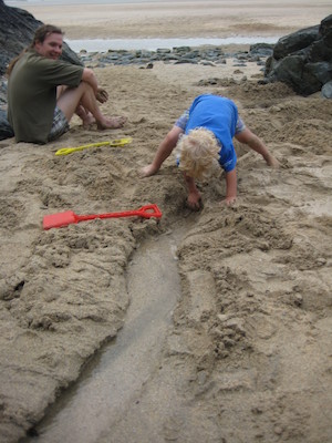 Cole digging a canal while Ben watches (07-13-2009 15:52)