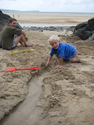 Cole digging a canal while Ben watches (07-13-2009 15:52)